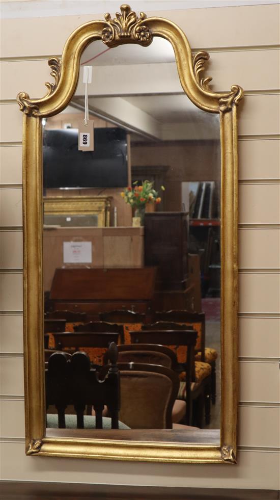 A reproduction gilt framed wall mirror H.102cm